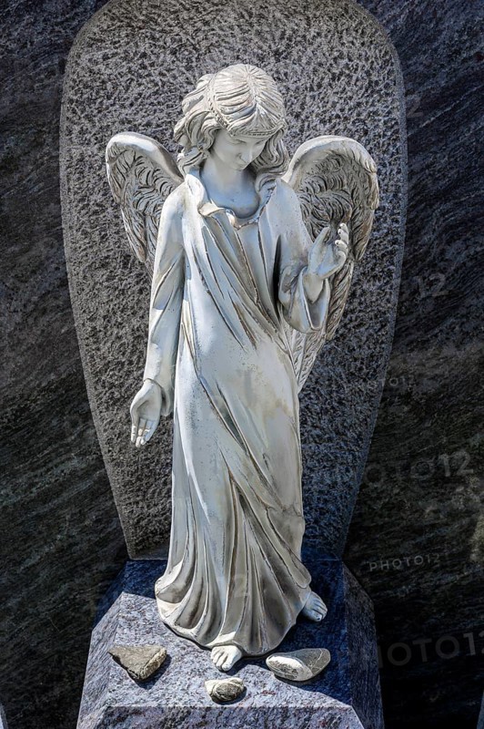 Ceramic angel as grave decoration