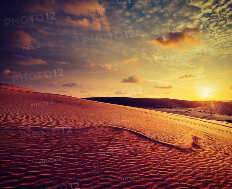 Vintage retro effect filtered hipster style image of white sand dunes on sunset