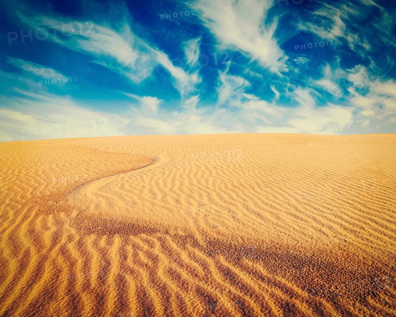 Vintage retro effect filtered hipster style image of white sand dunes on sunrise