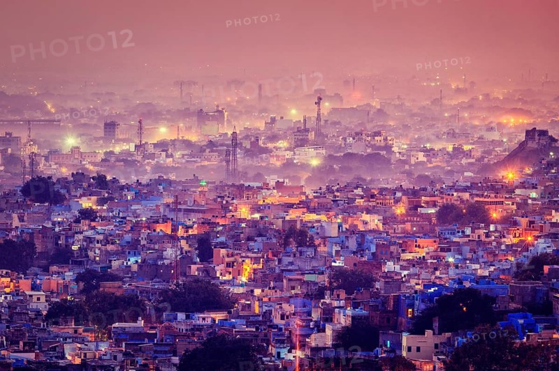 Vintage retro effect filtered hipster style image of Jodhpur aka Blue City due to the vivid blue-painted Brahmin houses around Mehrangarh Fort in the evening twilight. Jodphur