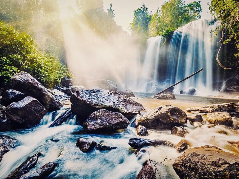 Vintage retro effect filtered hipster style image of tropical waterfall Phnom Kulen