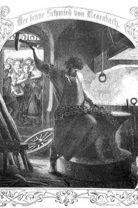 A blacksmith at work with a big hammer