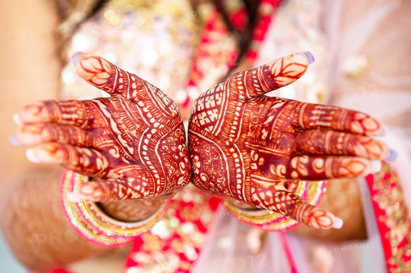 Beautiful henna design on hand of Hindu bride