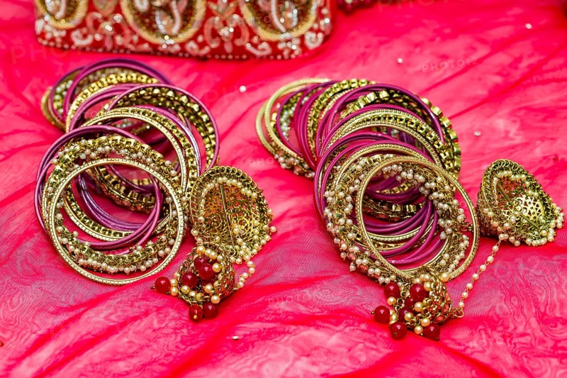 Closeup of Hindu brides bangles on red
