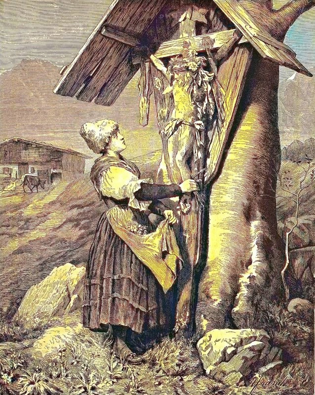 Woman in front of a field cross in the Alps