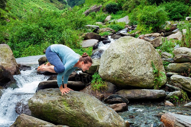 Woman doing Kakasana asana