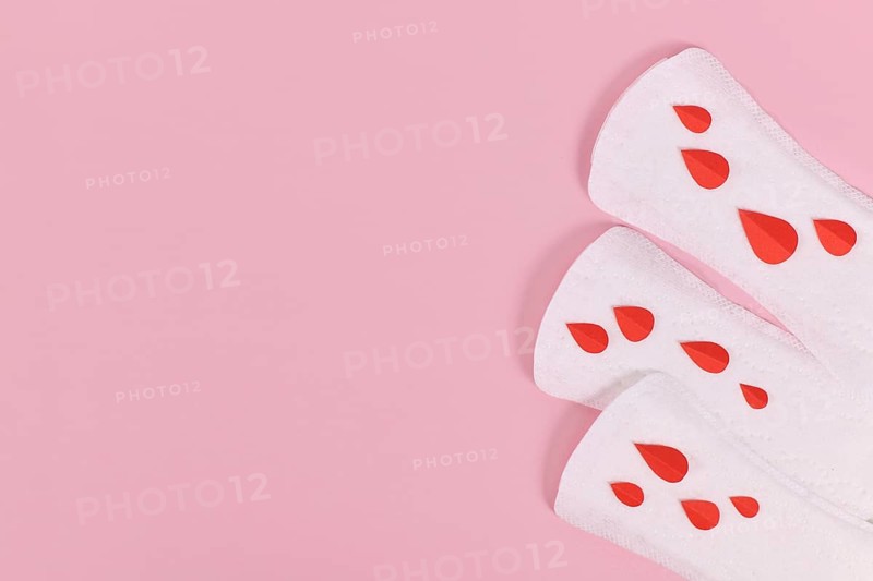 Female period concept with panty liner with symbolic paper blood