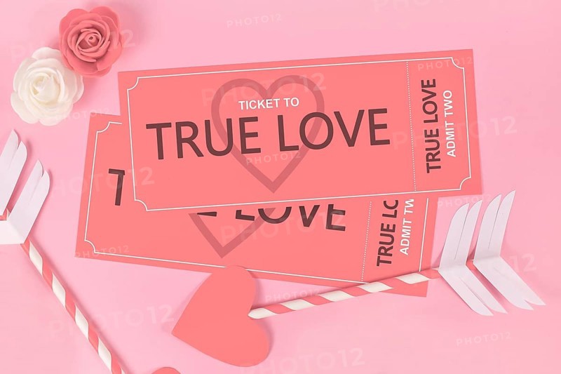 Valentines day concept with True Love ticket and cupid arrows on pink background
