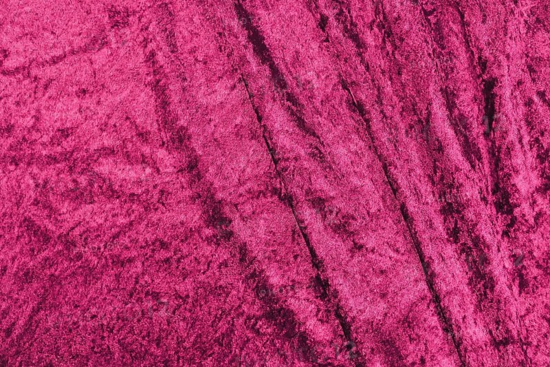 Dark pink panne velvet textile texture with folds