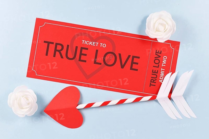 Red True Love ticket and cupid arrow on blue background for Valentines day