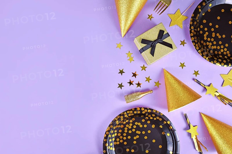Party flat lay with black and golden plates
