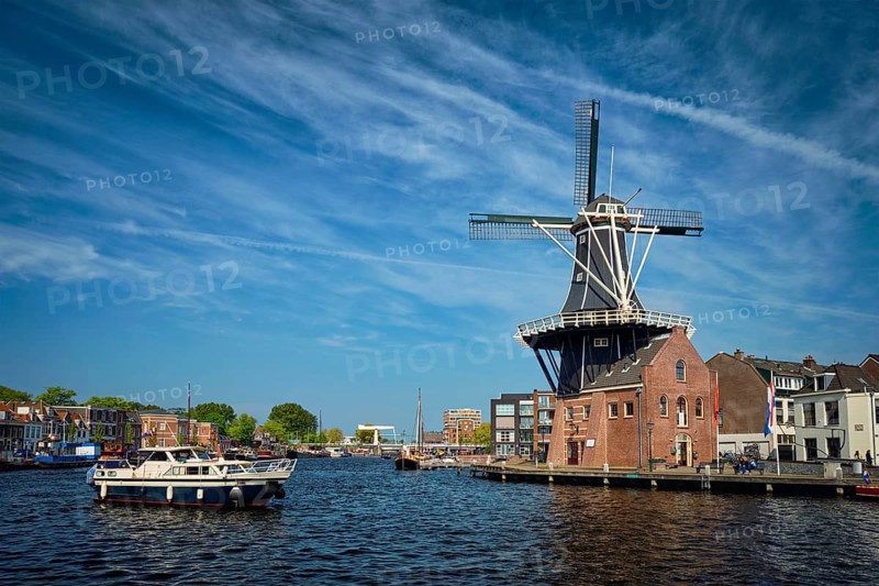 View of Harlem landmark windmill De Adriaan on Spaarne river. Harlem