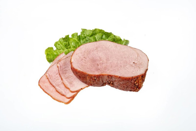 Smoked beef and greenery on an isolated studio background