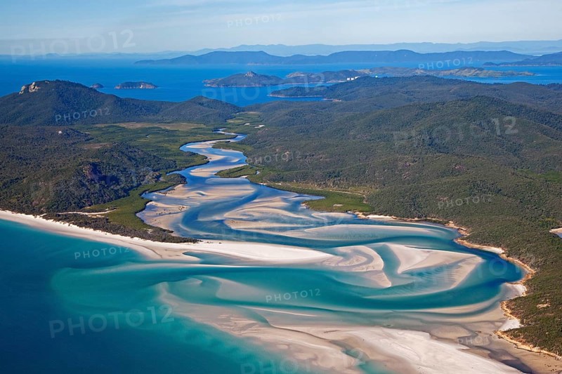 Area view of white sandy beaches and turquoise waters of Whitehaven Beach on Whitsunday Island in the Coral Sea