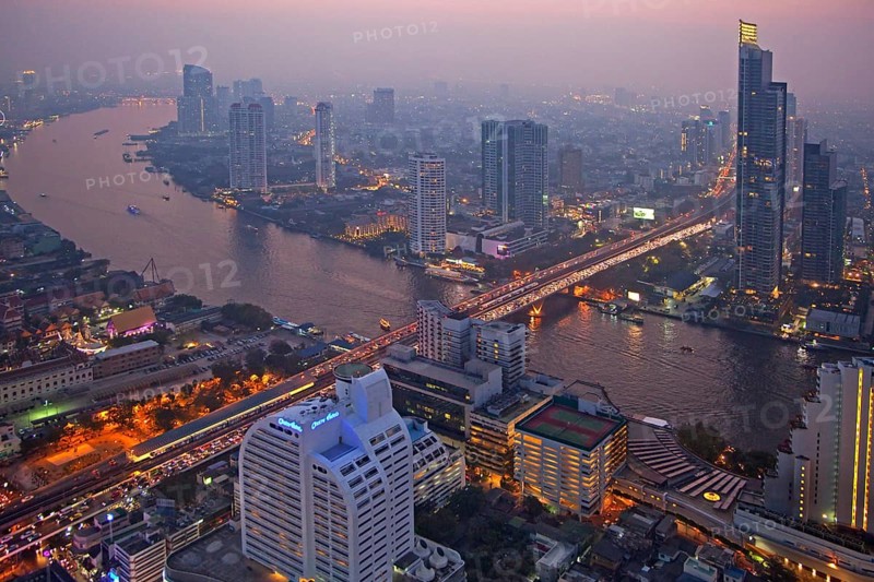 The Bangkok skyline at night and view of the Chao Phraya River