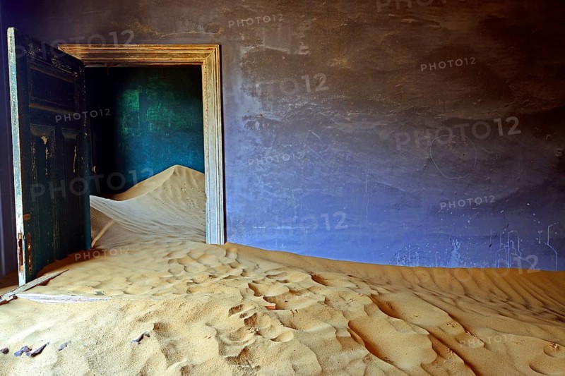 Residential buildings taken over by desert sand