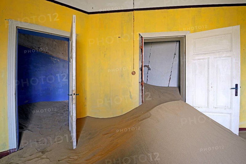 Residential buildings taken over by desert sand
