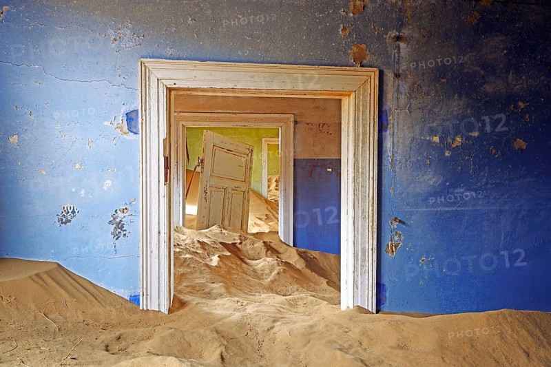 Residential buildings taken over by desert sand