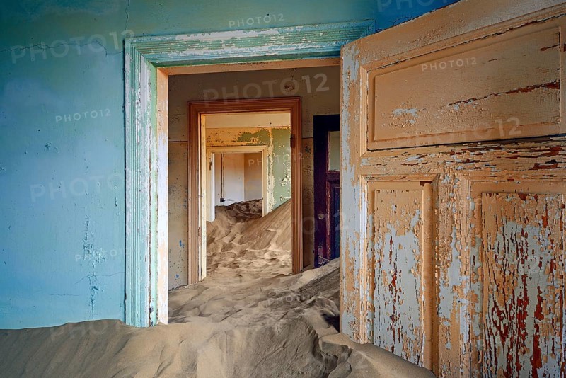 Residential buildings taken over by desert sand