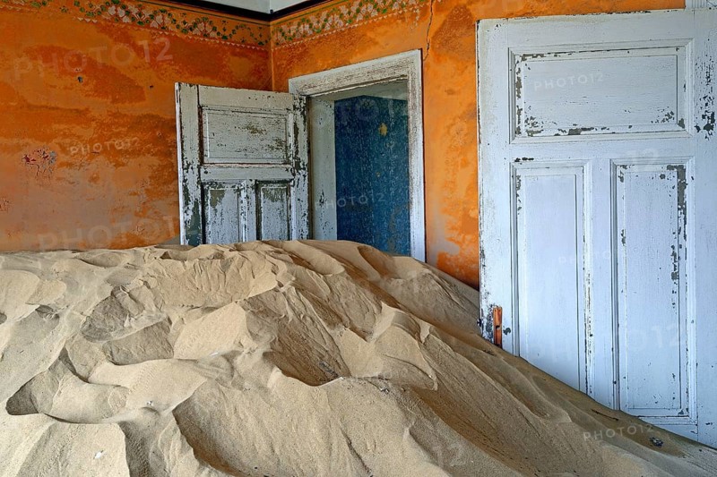Residential buildings taken over by desert sand