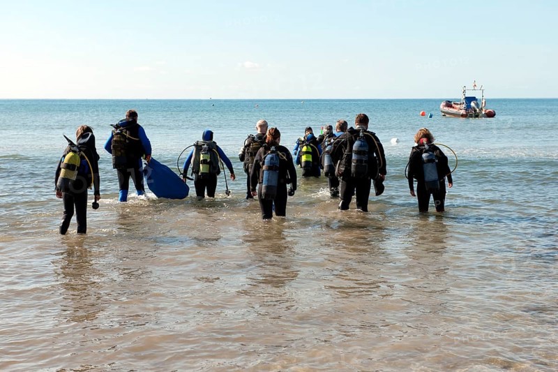 Divers run into the sea