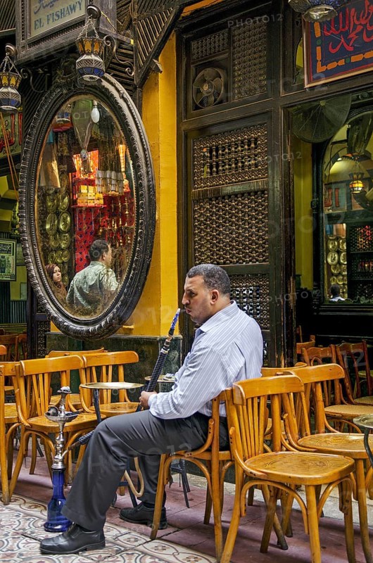 Man smoking in cairo cafe in egypt