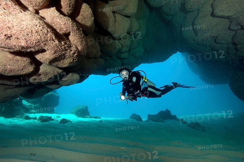 Divers in underwater cave off Punta Cana