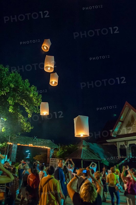 Releasing sky lanterns during the Festival of Lights
