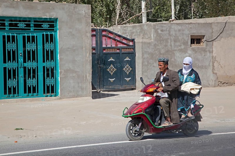 Uyghur man in traditional Muslim dress