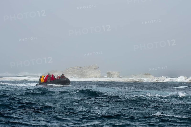 Zodiac with tourists approaching Herald Island