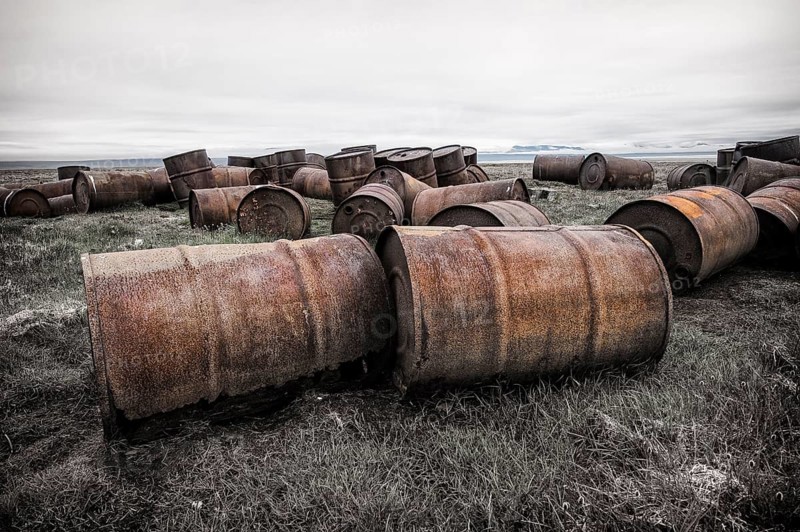 Rusted barrels in the tundra