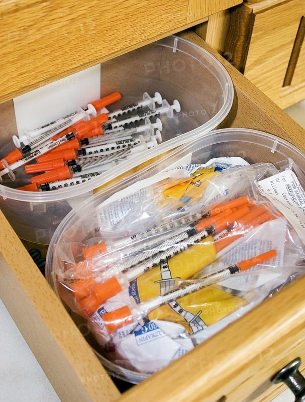 Drawer with insulin syringes for diabetic domestic cats