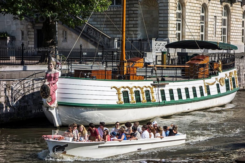 Tourists in a boat on the river Leie