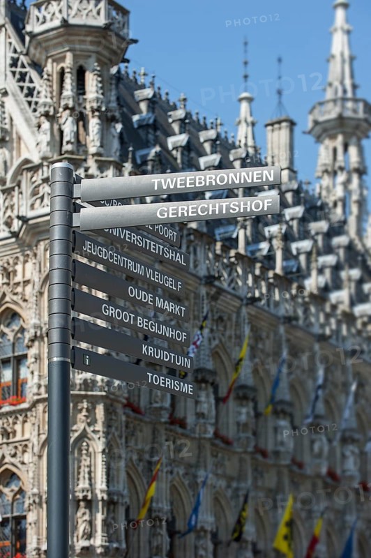 Signpost in front of the Gothic Town Hall at the Grote Markt