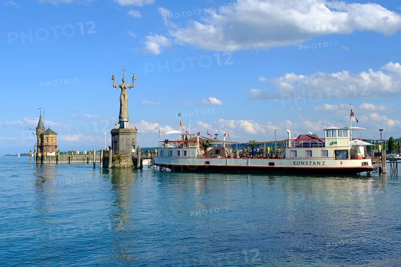 Sculpture Imperia and ship at the harbour entrance