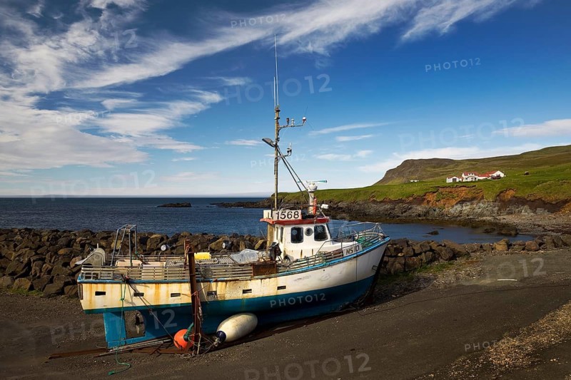 Fishing boat and farm at Hafnarholmi harbour