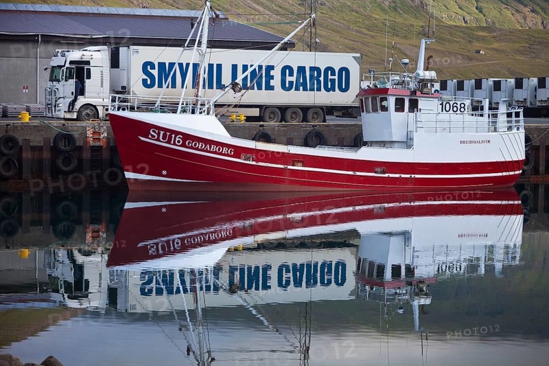 Symril Line Cargo fishing boat and truck in harbour