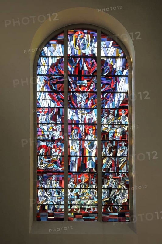 Colourful stained glass window of the neo-Romanesque St. John the Baptist Church in Todtnau