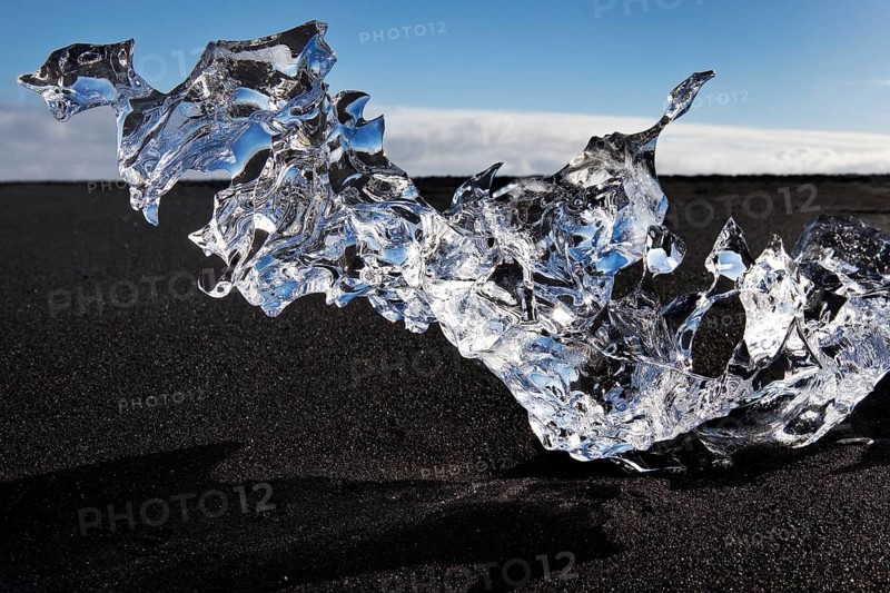 Glacial ice on black beach at Breidarmerkursandur