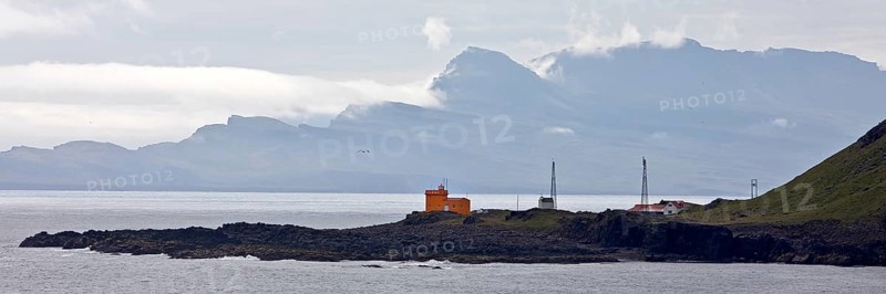 Landscape at Seydisfjoerdur with the lighthouse in Dalatangi