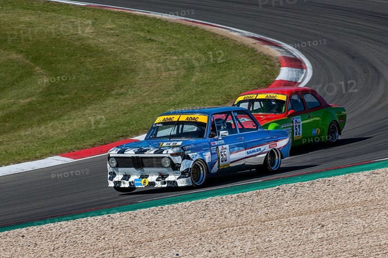 Historic race cars in front BMW 2002ti behind Ford Escort at car race for classic cars Youngtimer Classic Cars 24-hour race 24h race