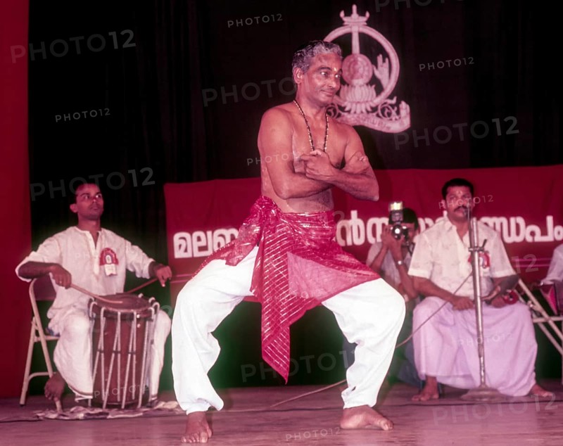 Kalamandalam Gopi demonstrating kathakali exercise in Kerala Kalamandalam