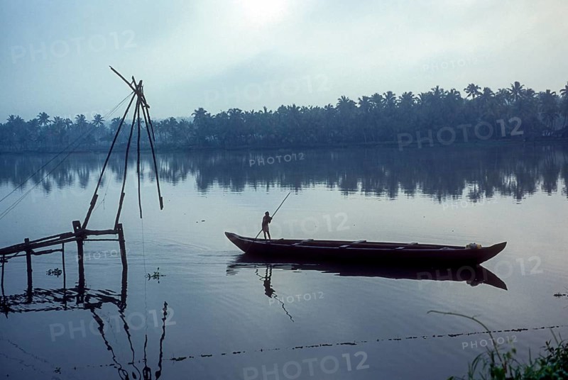 Chinese fishing net and a fishing boat backwaters of Kodungallur