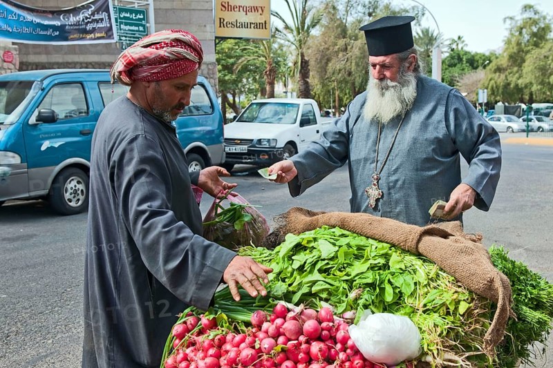 Vegetable vendor and Greek Orthodox priest