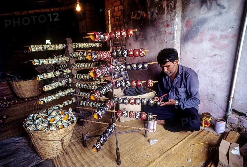 Painting a wooden toy at Channapatna a flourishing centre for lacquerware painted wooden toys near Bengaluru Bangalore