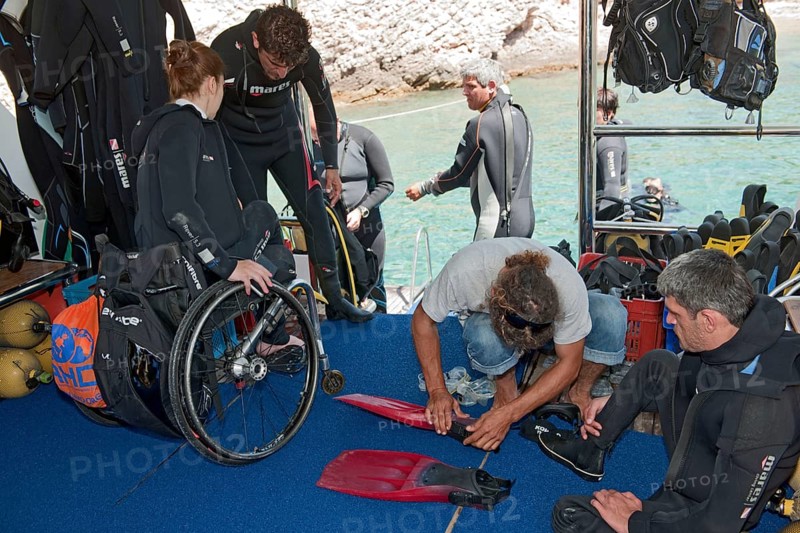 Disabled divers on board diving ship