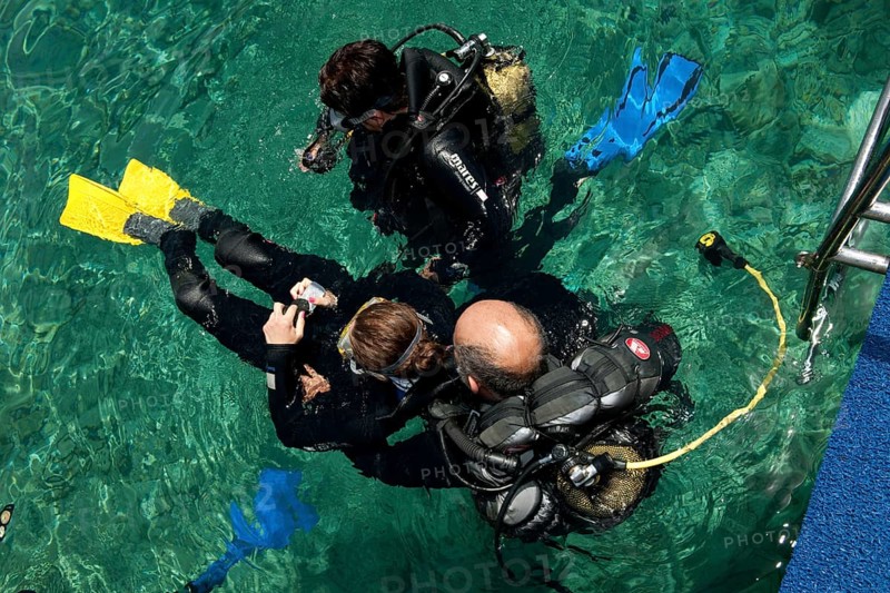 Disabled diver with instructor in the sea
