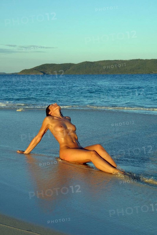 Woman at nudist at the sea