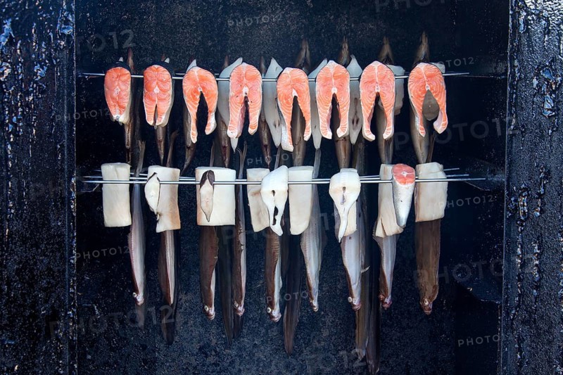 Smoking sea fish and plaice in the smoker