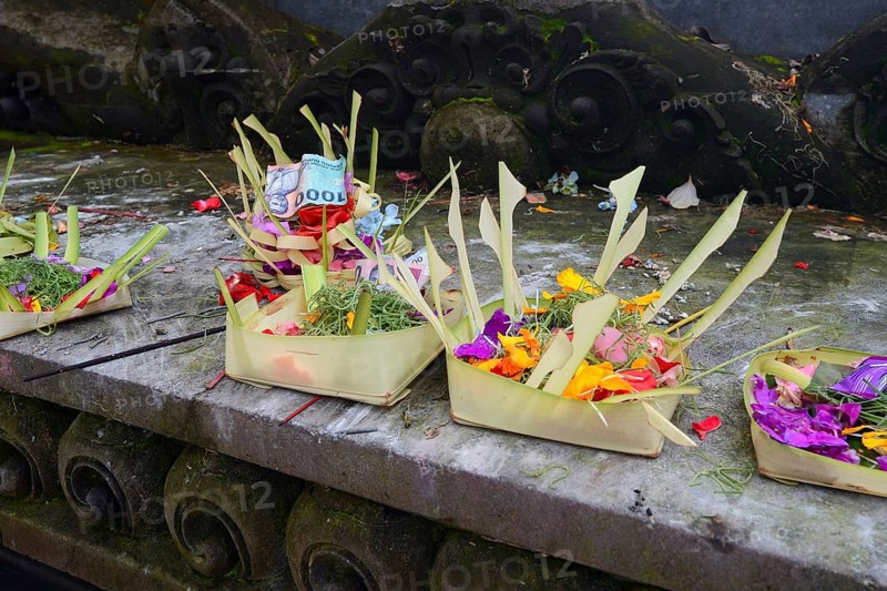 Offering baskets filled with money and flowers